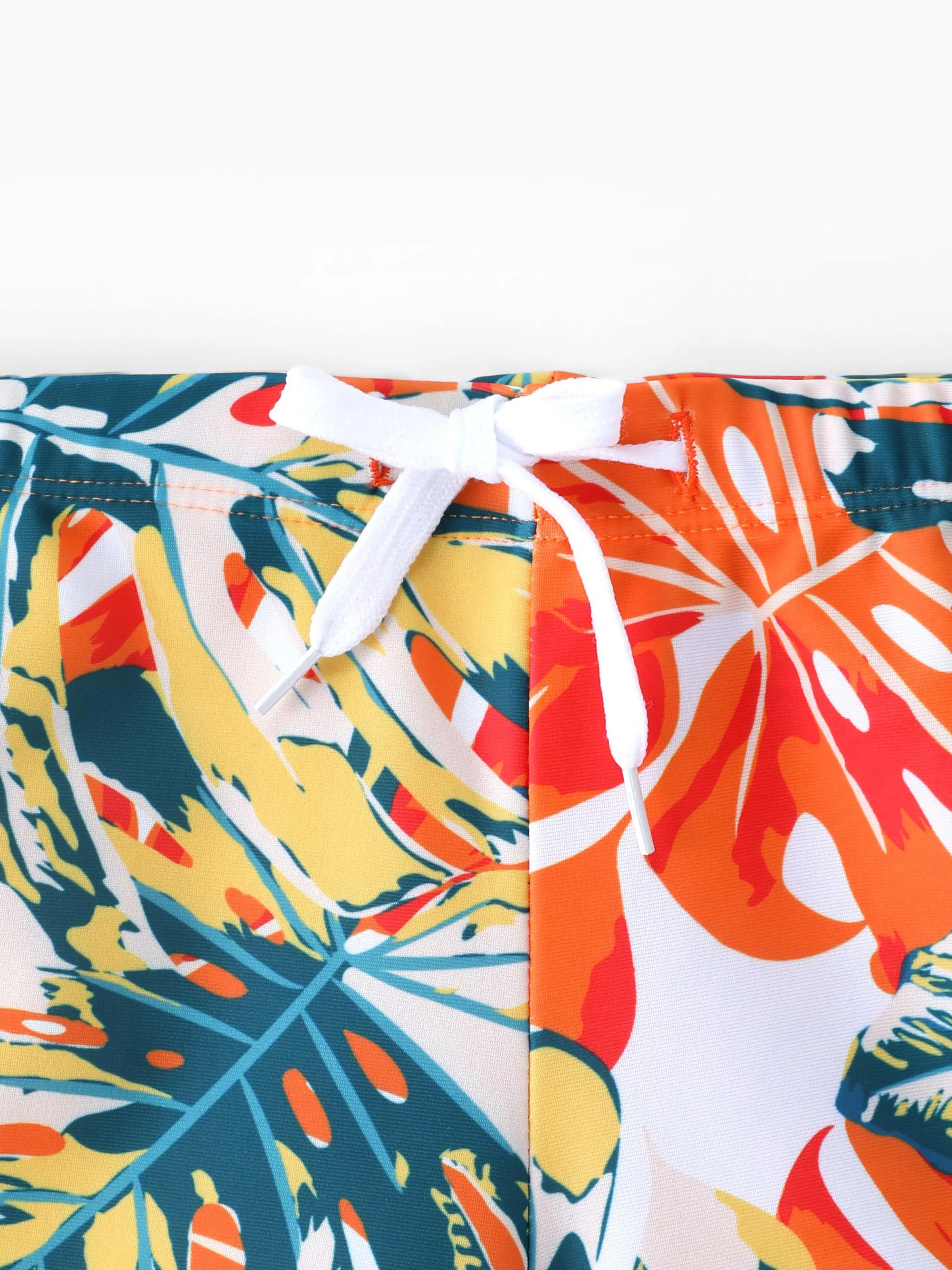 26420-toddler-boy-orange-and-all-over-tropical-plant-print-splicing-ruffle-swim-trunks-shorts-orange-color-5.webp Toddler Boy Orange and All Over Tropical Plant Print Splicing Ruffle Swim Trunks Shorts Orange color